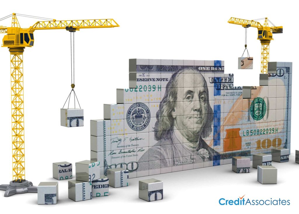 Construction cranes building a 100 dollar bill