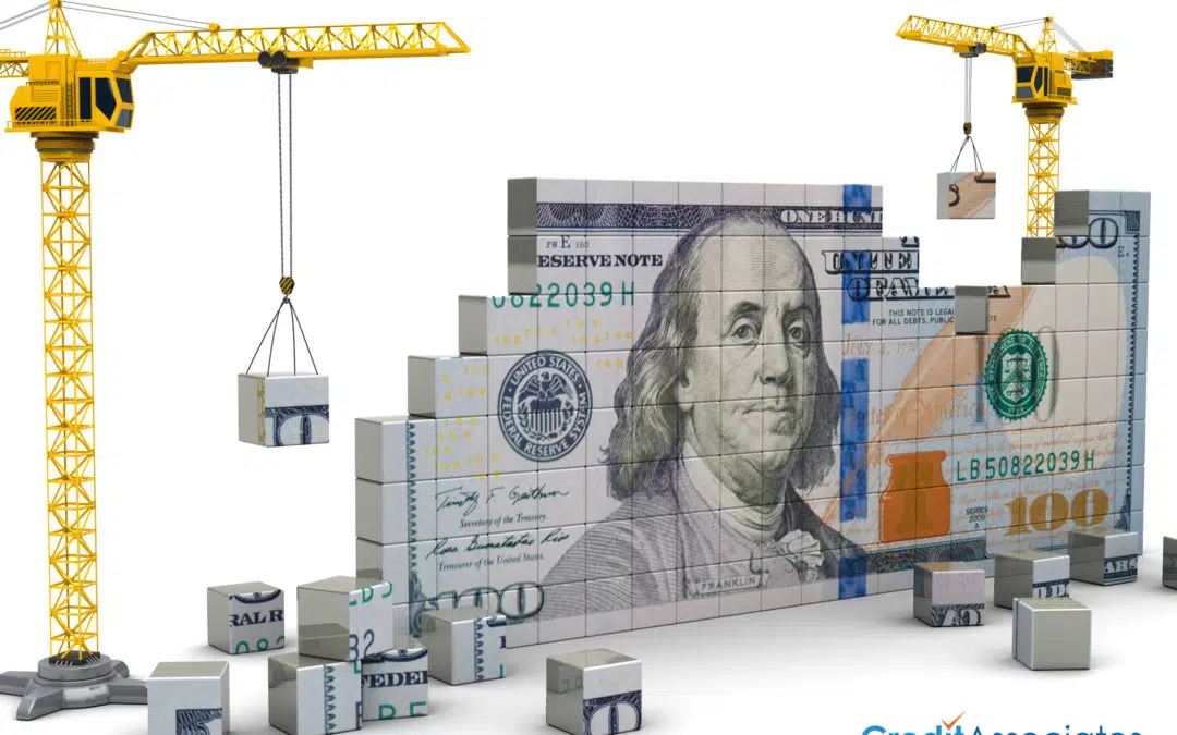 Construction cranes building a 100 dollar bill
