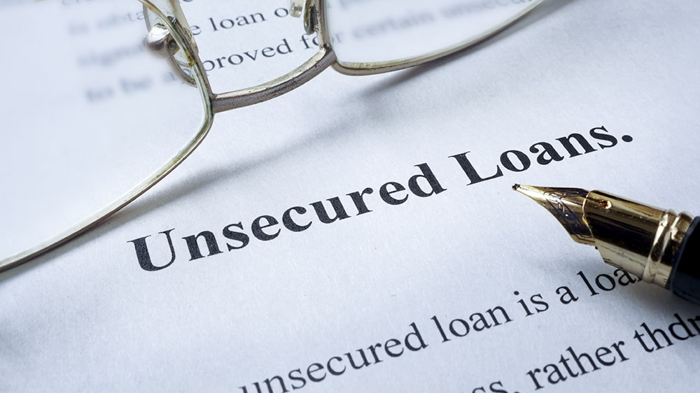 Typed "Unsecured Loans" on top of paperwork.